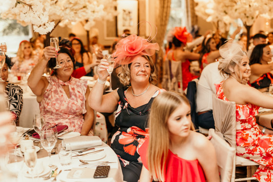 Guests toast at wedding meal at Norwood Hall Hotel